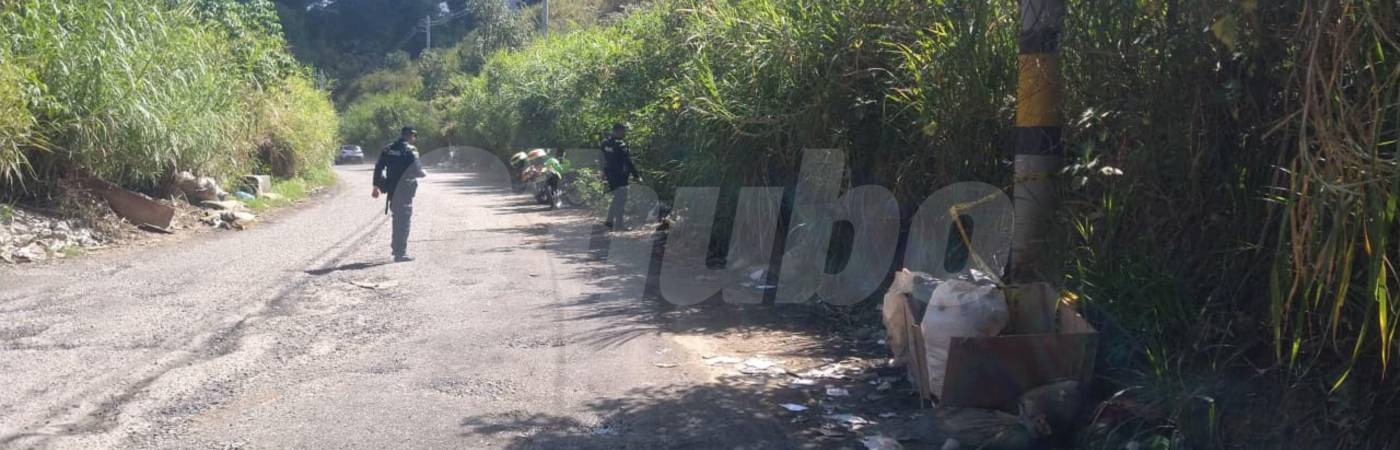 Una patrulla de la Policía encontró el cadáver cuando hacía un recorrido por la vía que comunica al barrio Santa Rita con la autopista Medellín-Bogotá. FOTO: GUILLERMO LEÓN OSPINA MUÑOZ