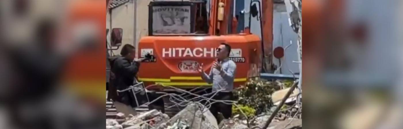 Momento en que se ejecutaba la grabación del presunto video musical sobre los escombros de una edificación en Pereira. FOTO: TOMADA DE X @COLOMBIAOSCURA