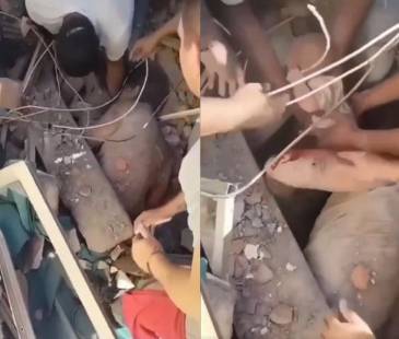 Rescate de un bebé bajo los escombros en Cali. FOTO: REDES