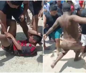 Hasta las mujeres se metieron a golpear al sujeto que habría realizado tocamientos a menores en una playa de Santa Marta. FOTO: CAPTURA VIDEO @LUCHOVOLTIOS