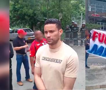 José Luis Chunga (izq) hablando con hinchas del Independiente Medellín. FOTO: LA PUTERÍA ROJA OFICIAL 