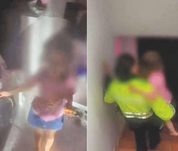Unidades del Cuerpo Oficial de Bomberos Medellín fueron las encargadas de abrir la puerta de la casa donde estaba sola la menor de edad que fue sacada por policías de Infancia y Adolescencia. <b><span class="mln_small-caps_mln">/ FOTO: CAPTURAS DE VIDEO POLICÍA</span></b>